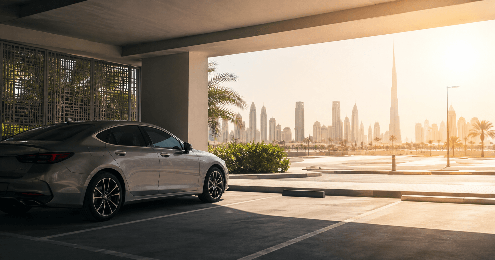 Car in a covered parking with Burj Khalifa view