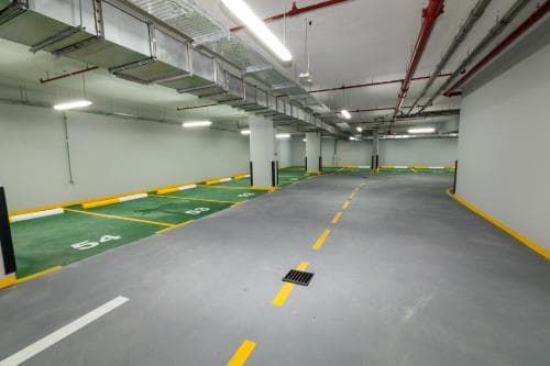 Covered indoor parking in Candace Acacia Near Furjan Metro Station